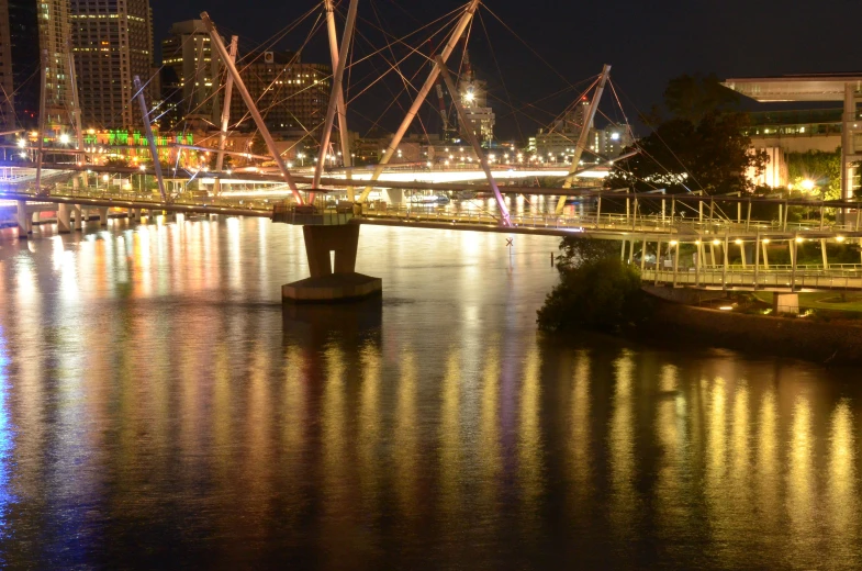 the boats are moving through the water at night