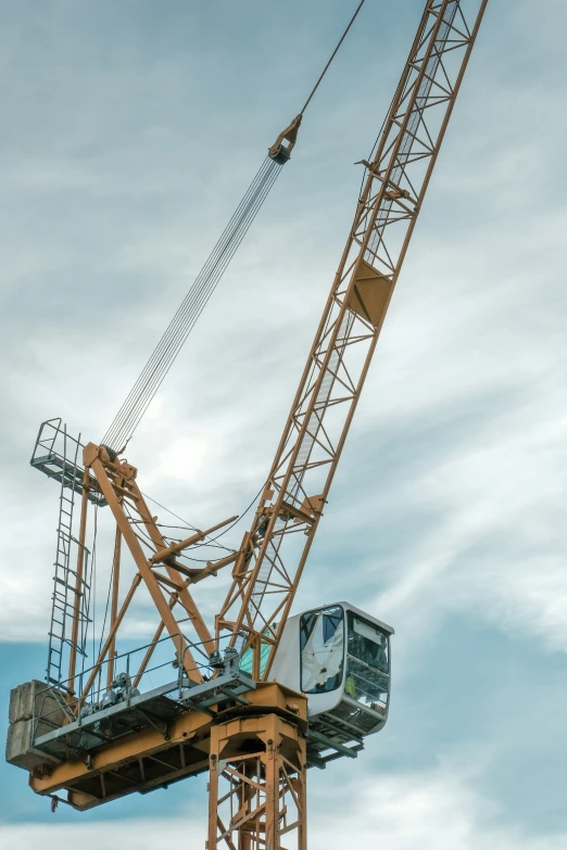 a crane is standing on top of a metal structure