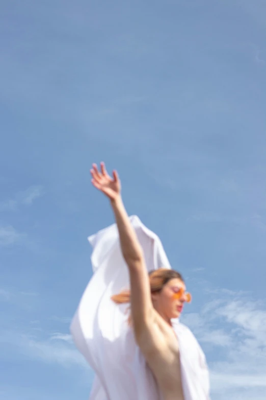 a man standing in the air while catching a frisbee