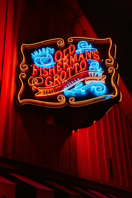 a sign has been decorated with blue and red lights
