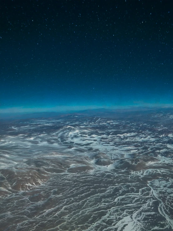 an image of some snow land and stars