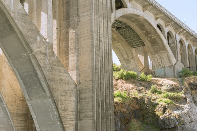 a tall bridge spanning the width of a river