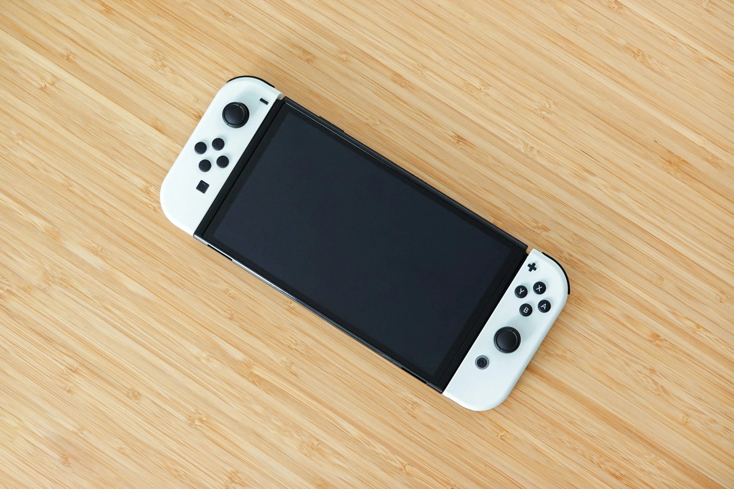 a white nintendo wii game console laying on the ground