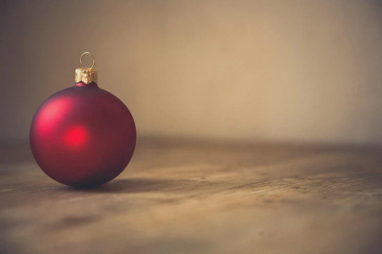 an ornament hanging from the end of a wooden table