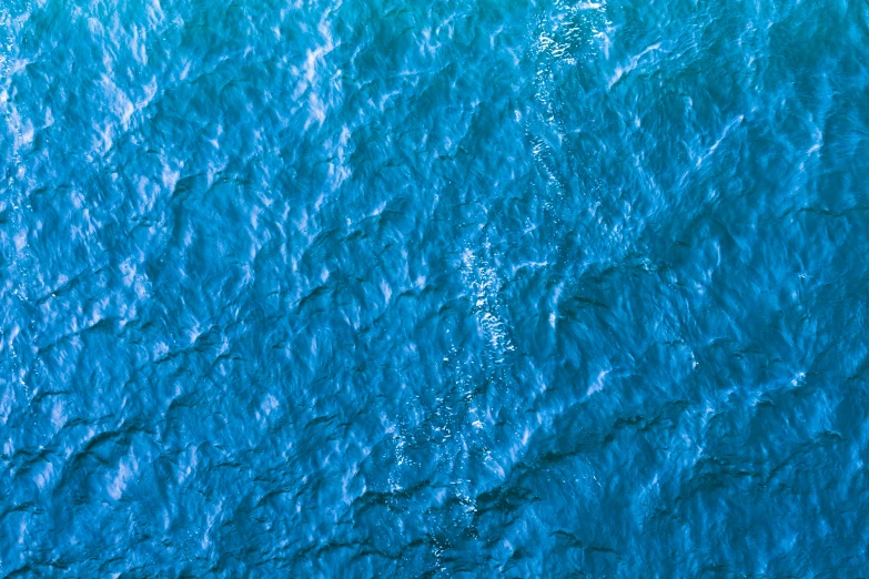 a very blue looking body of water