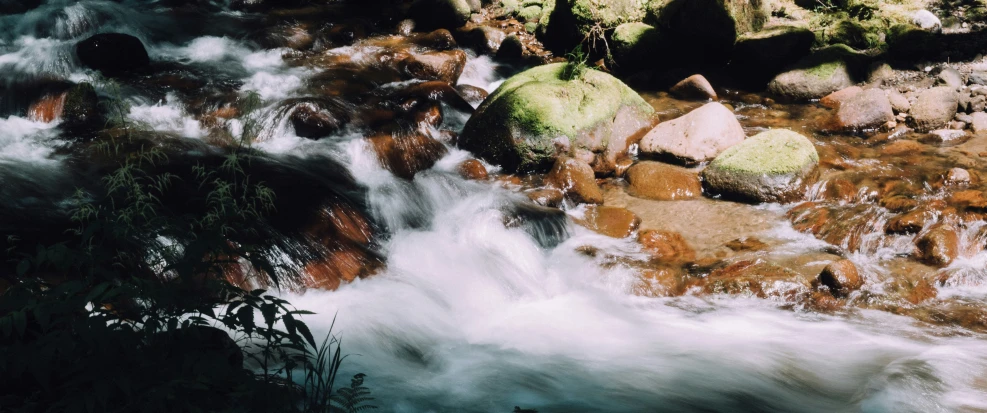 a body of water with rocks in it