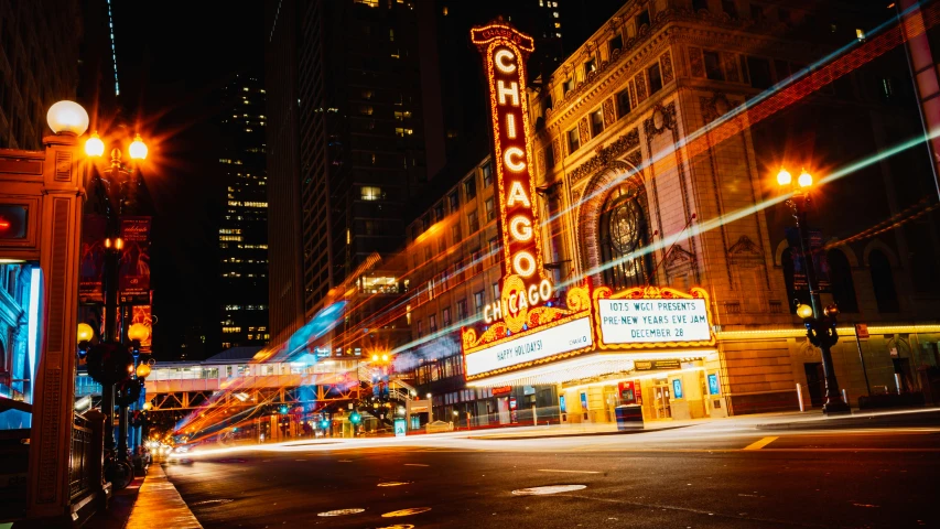 an empty street is lit up at night