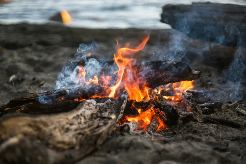 a close up of a camp fire burning