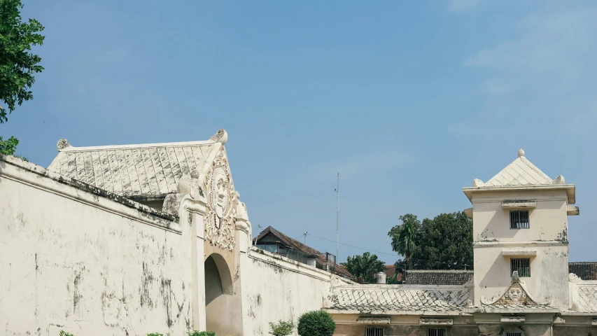 two white walls and clock tower at a museum