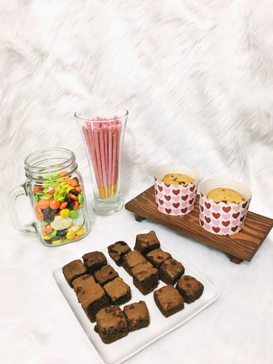 treats for valentines and chocolate lovers are arranged on a tray