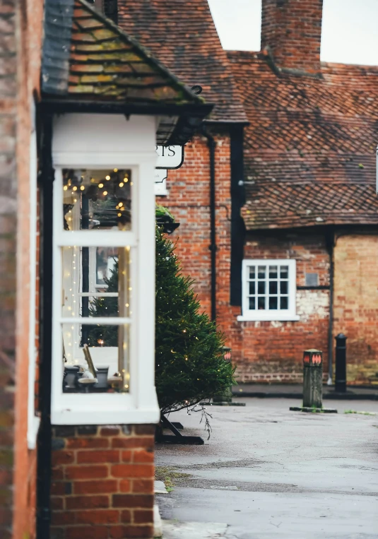 a store front with lights on its windows