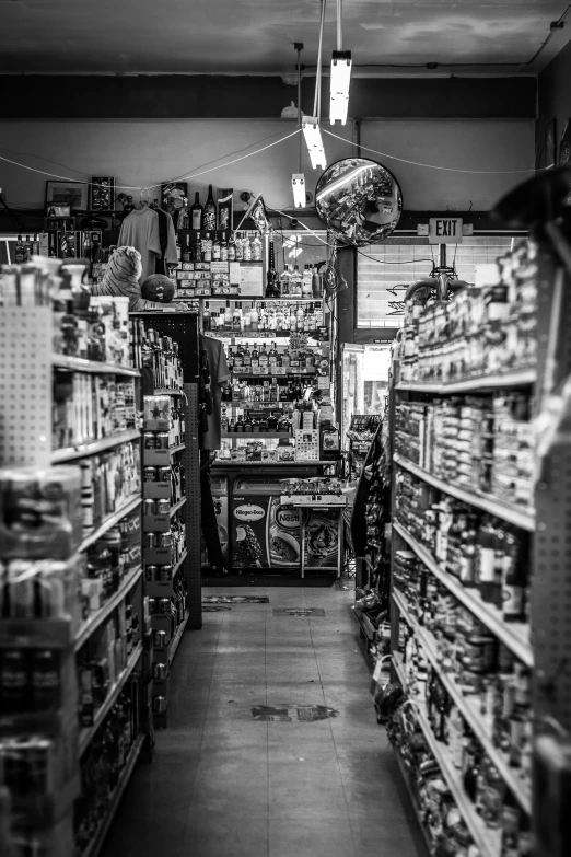 a black and white po of a store aisle