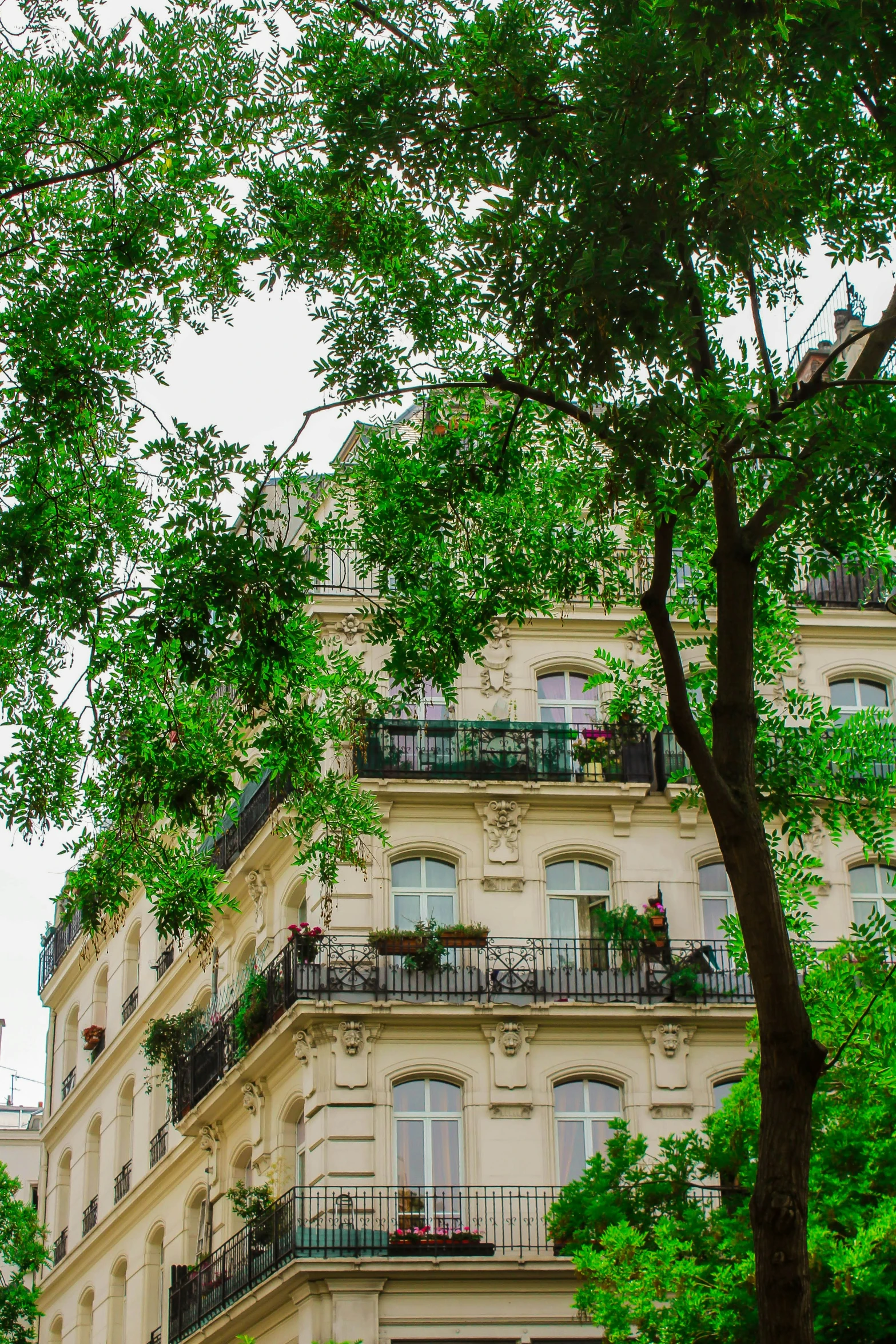 the corner of a building with many balconies