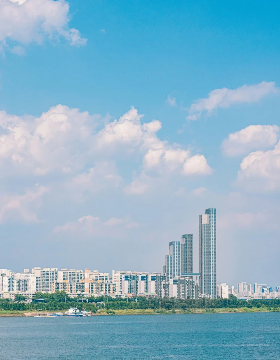 some buildings are by the water near a river