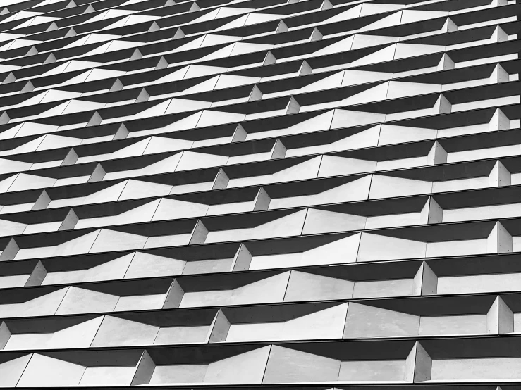 an abstract architectural structure consisting of rows of pointed, straight and triangular ridges