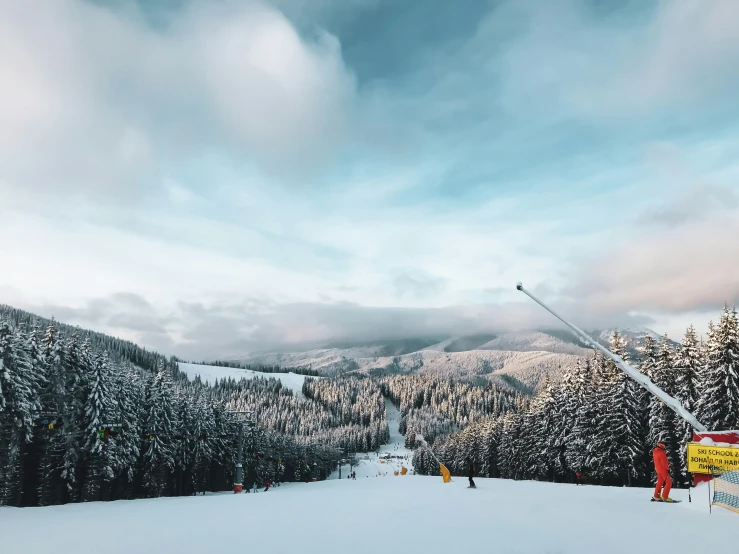 a ski slope on which people are skiing on the hill