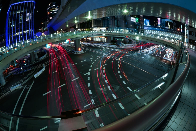 a city intersection has many cars and trucks