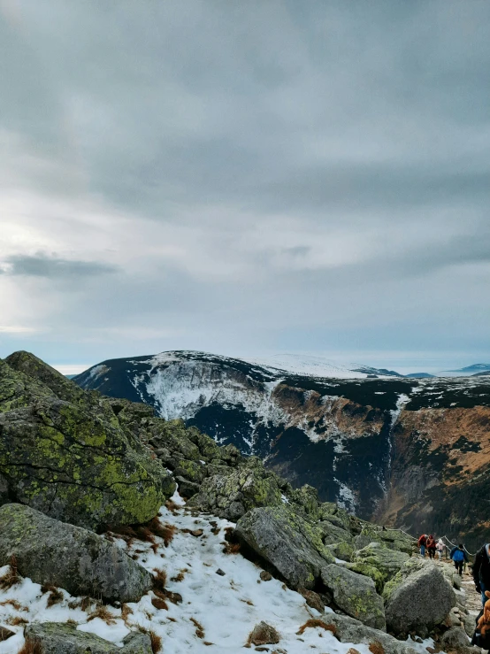 people hike up and down a mountain side