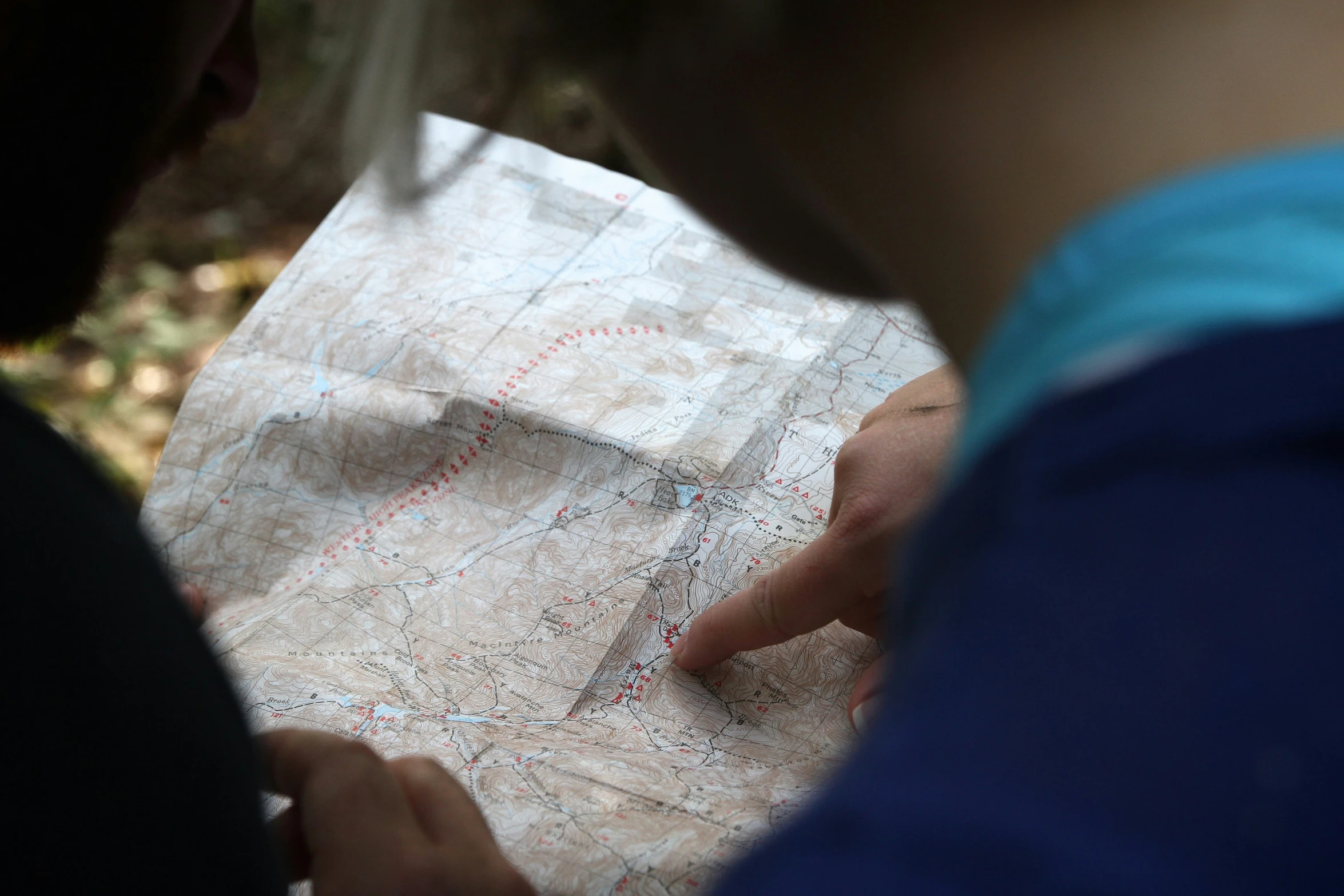 the man is pointing at a map with a hand