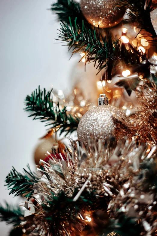 christmas ornaments and ornaments sit in the center of a tree