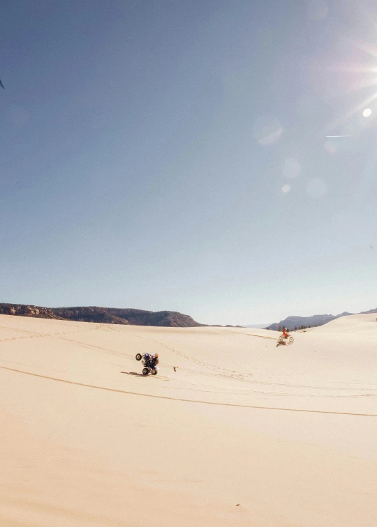 there are two people out on a snowy beach