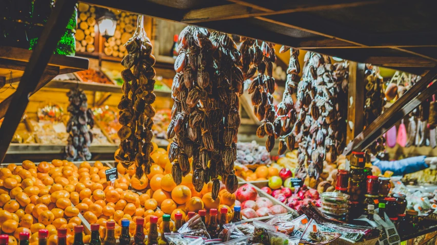 a market with several fruits hanging from it