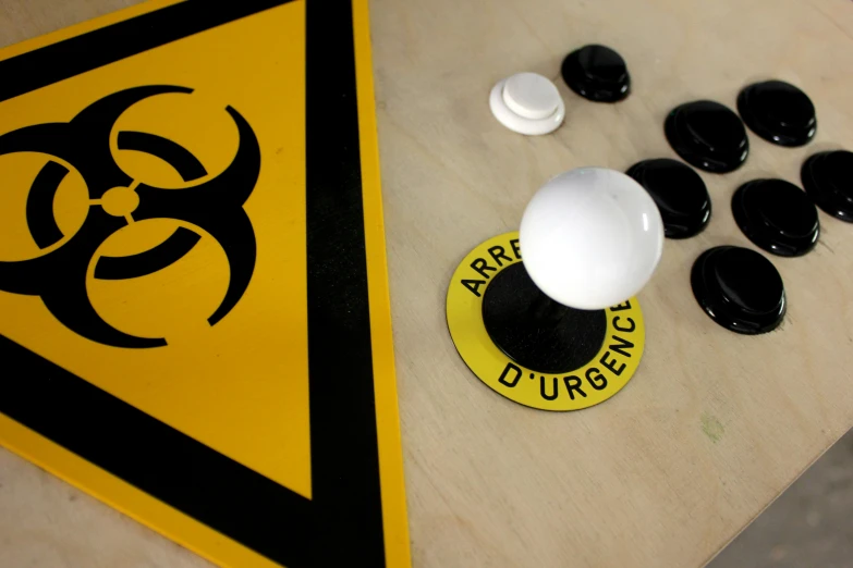 a yellow and black hazard sign and black s