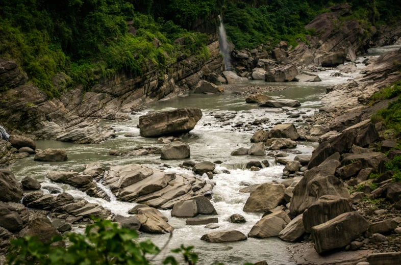 several rocks with water flowing from the rocks in it