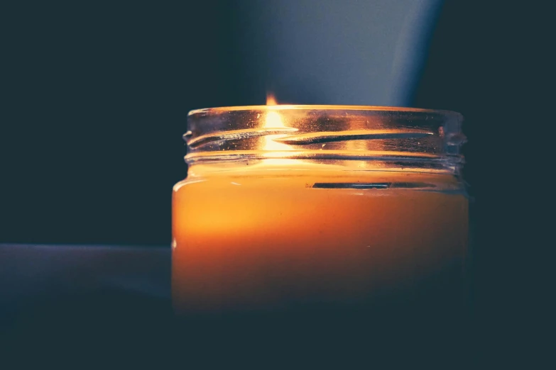 a candle on a table by itself