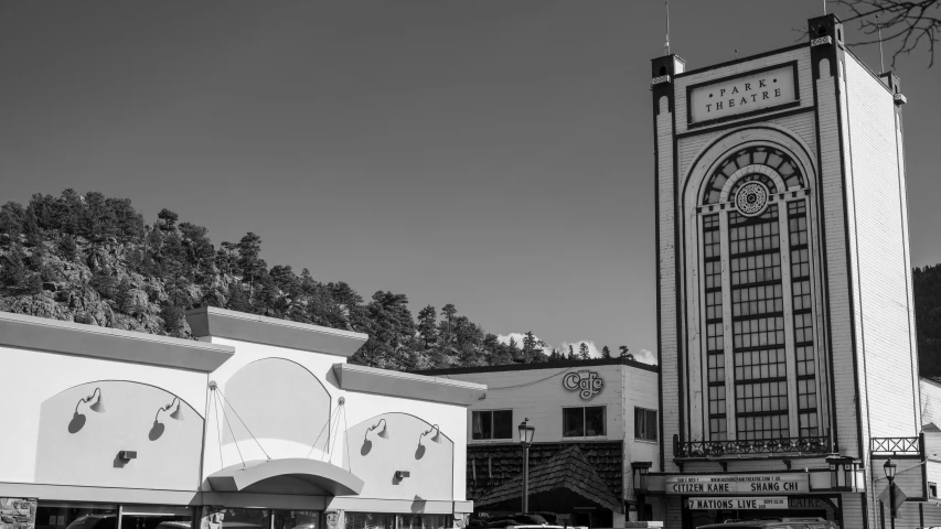 an old building and a tower with a clock on the top