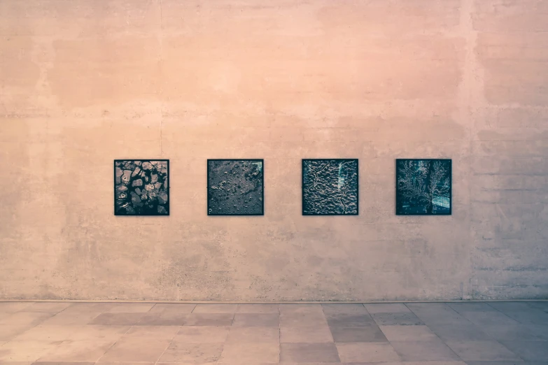 a cement wall with black and white paintings on it