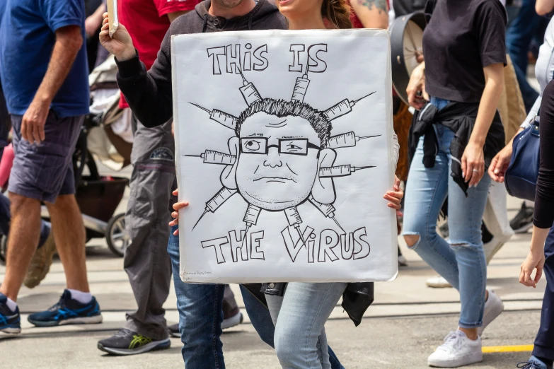 a woman in a protest rally with a sign