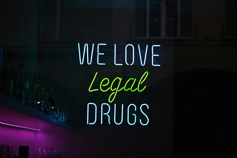 we love legal  neon sign displayed in dark