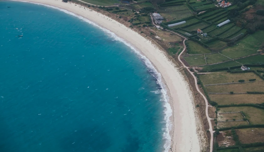 the coast of the ocean in a small city near a large beach