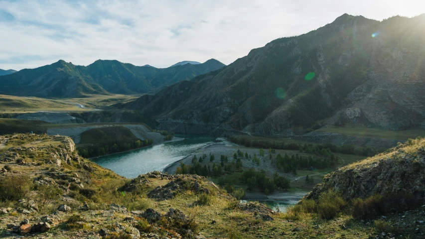 view from a high up hill of a river and hills