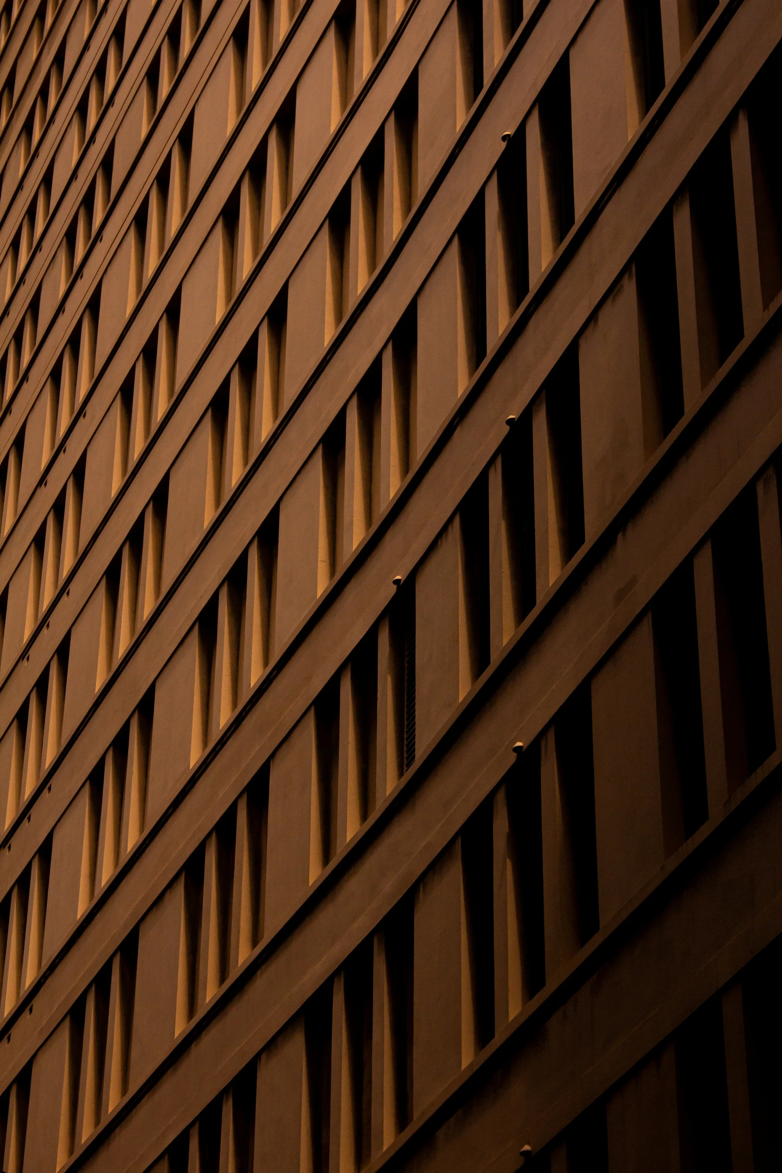 a very tall building with many windows and a clock