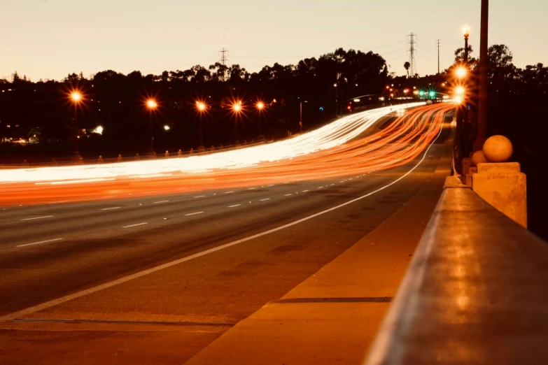 the street lights are reflecting off of the road