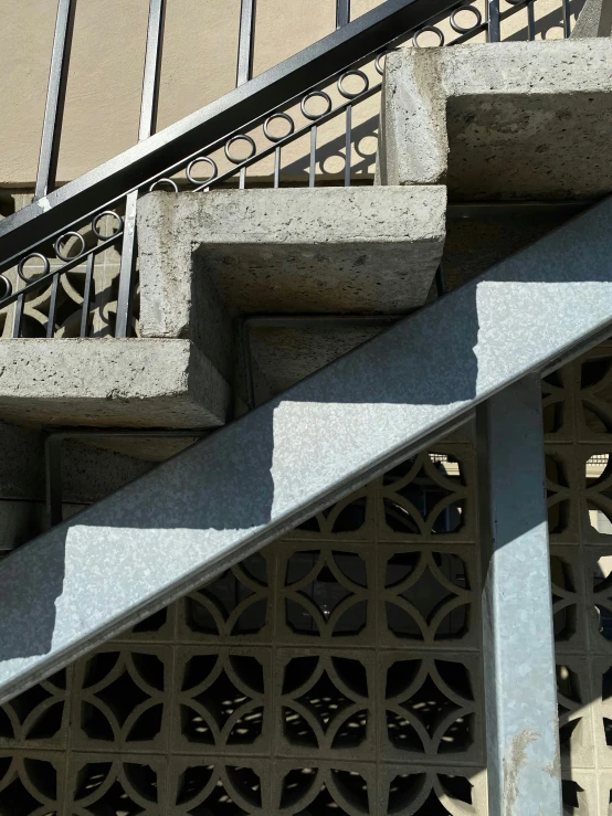 concrete stairs and railings leading to a building