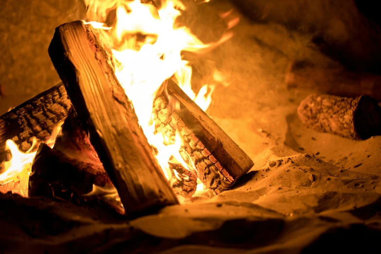 a close - up of fire burning inside a fire place