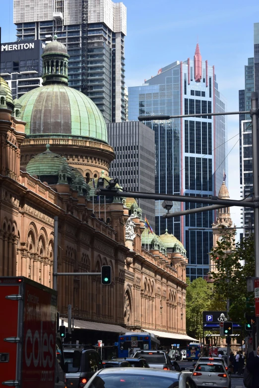 a city street with tall buildings and lots of traffic