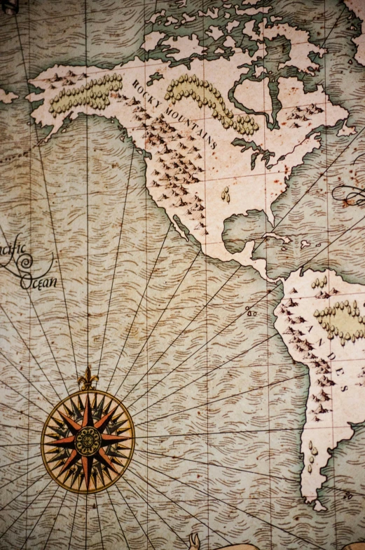an old, antique world map is shown on a wall