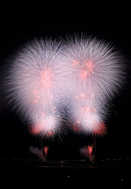 a fireworks display over a lake during a celetion