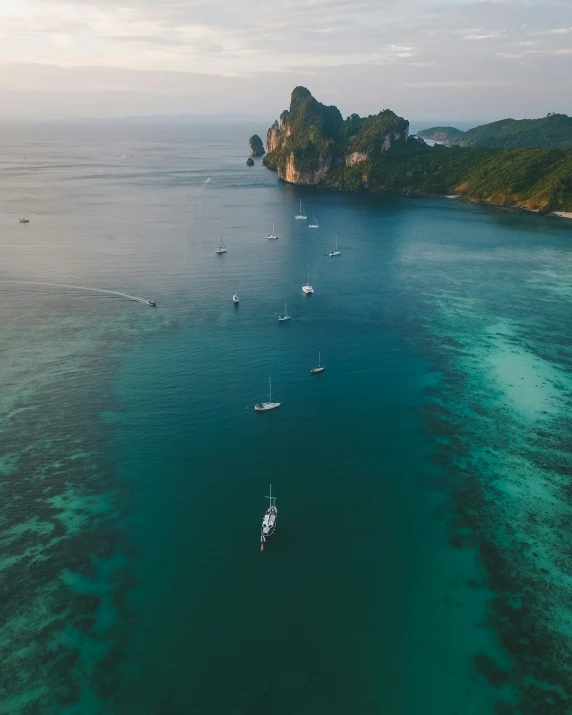 a wide view of boats on the water near land and water