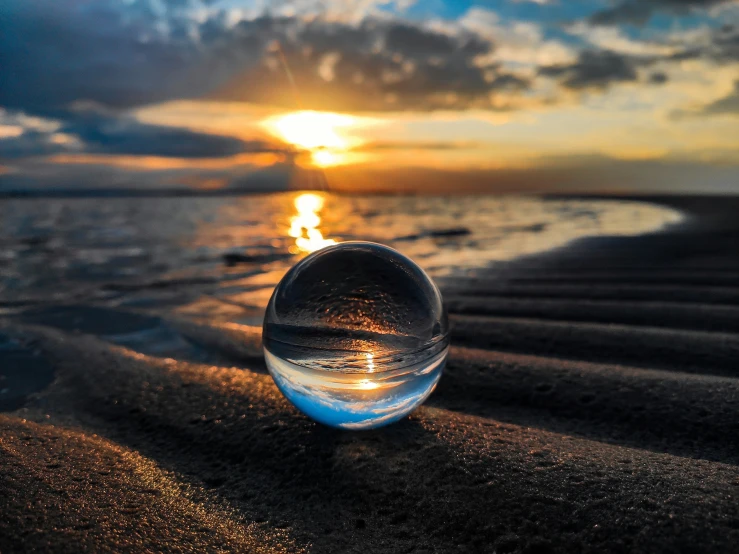 some water in a plastic bottle on a beach