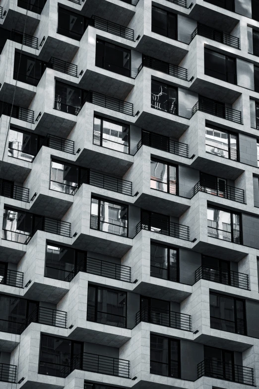 an image of a building with balconies that is very tall