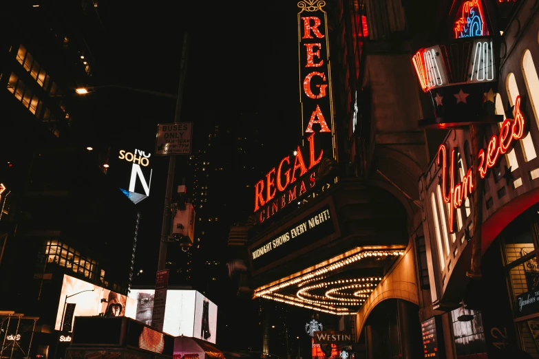 this is a street with neon signs and buildings