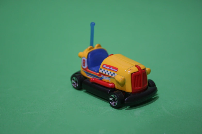 the plastic toy truck has a blue antenna