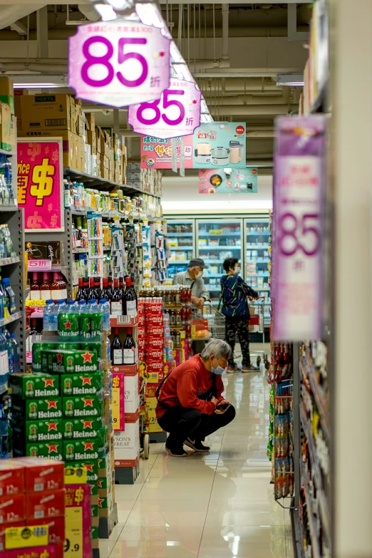 an older couple shopping in a store with their child