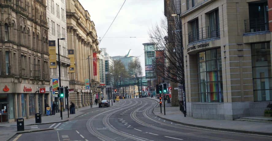 a city street with a bunch of tall buildings on each side