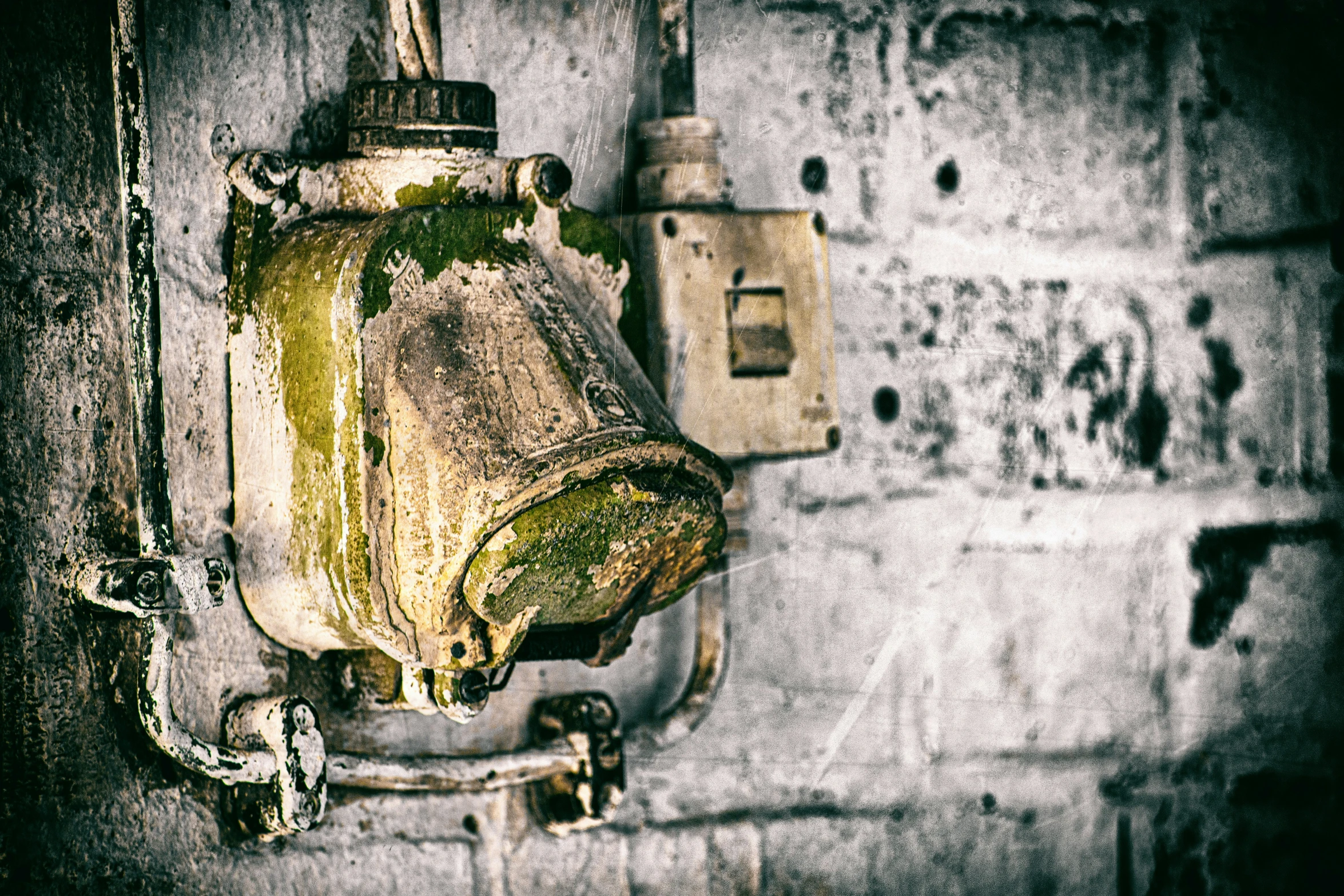 a small flask bottle hung up on the wall